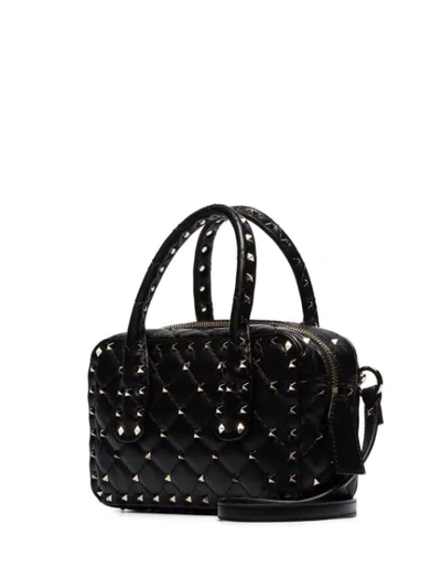 Shop Valentino Garavani Small Spike Duffle Bag In Black