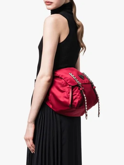 Shop Prada Studded Belt Bag In Red