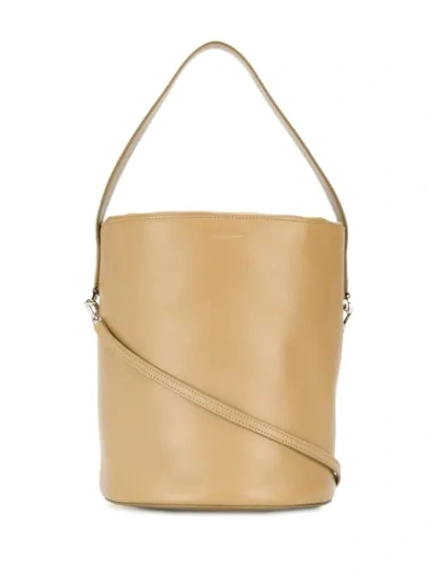 Shop Jil Sander Logo-embossed Bucket Bag In Brown