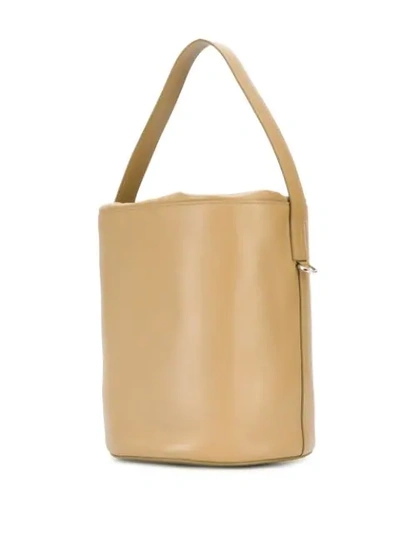 Shop Jil Sander Logo-embossed Bucket Bag In Brown