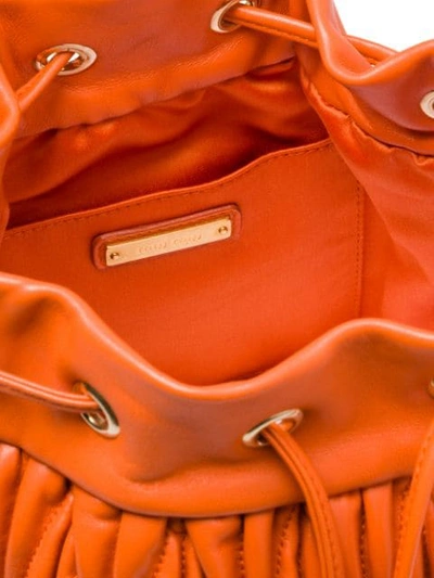 Shop Miu Miu Matelassé Drawstring Bucket Bag In Orange