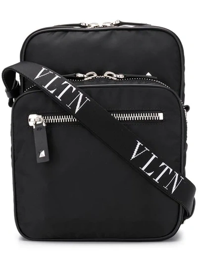 Shop Valentino Vltn Messenger Bag In Black