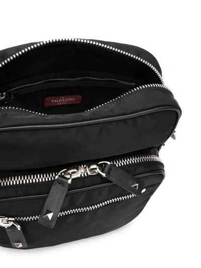 Shop Valentino Vltn Messenger Bag In Black