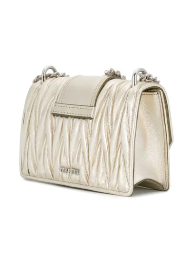 Shop Miu Miu Embellished Shoulder Bag In Metallic