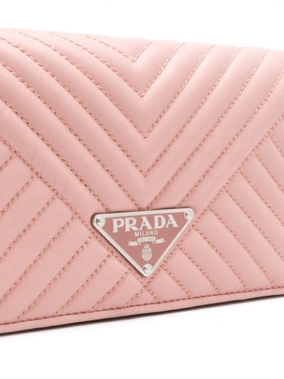 Shop Prada Logo Plaque Quilted Clutch In Pink