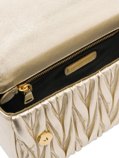 Shop Miu Miu Matelassé Textured Shoulder Bag In Gold