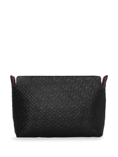 Shop Burberry Medium Monogram Leather Clutch In Black