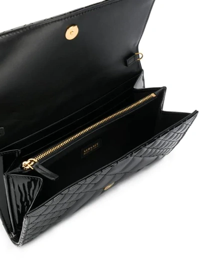 Shop Versace Medusa Head Quilted Clutch In Black