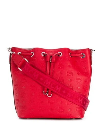 Shop Mcm Embossed Logo Bucket Bag In Red