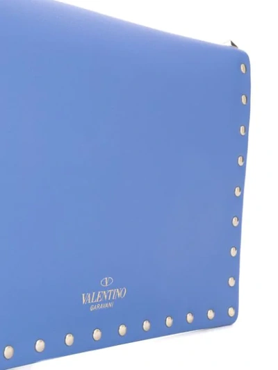 Shop Valentino Garavani Medium Rockstud Clutch In Blue