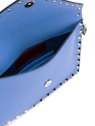 Shop Valentino Garavani Medium Rockstud Clutch In Blue