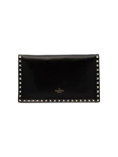 Shop Valentino Rockstud Clutch In Black