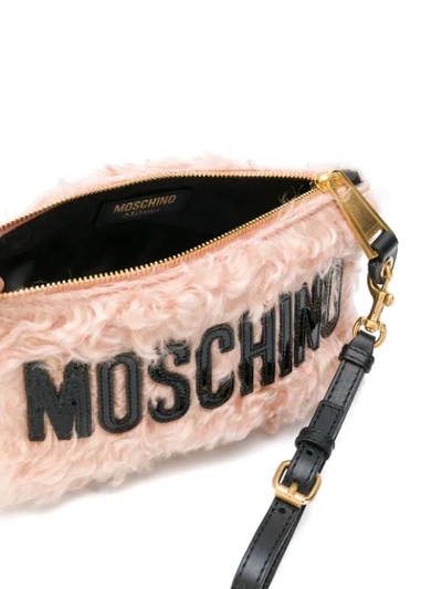 Shop Moschino Logo Envelope Clutch In Pink