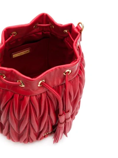 Shop Miu Miu Matelassé-effect Bucket Bag In Red