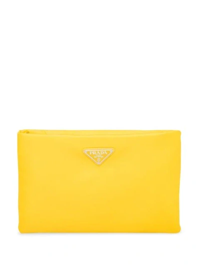 Shop Prada Padded Clutch Bag In Yellow
