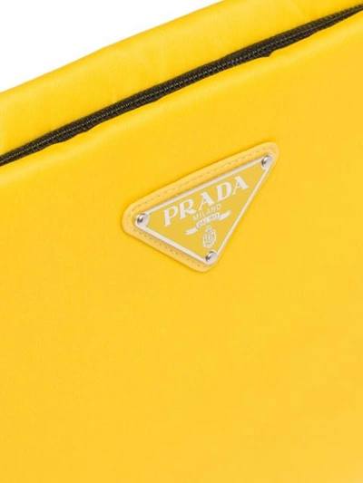 Shop Prada Padded Clutch Bag In Yellow