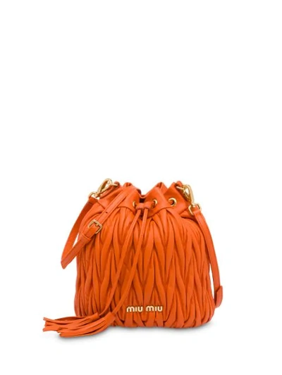 Shop Miu Miu Matelassé Bucket Bag In Orange