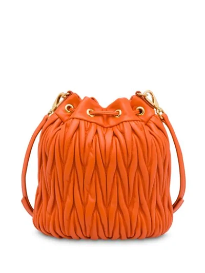 Shop Miu Miu Matelassé Bucket Bag In Orange