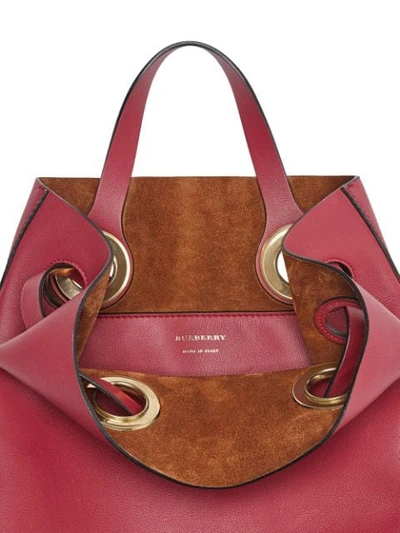 Shop Burberry The Leather Grommet Detail Backpack In Red
