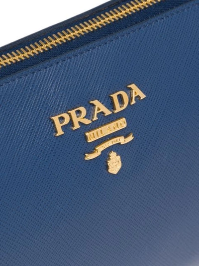 Shop Prada Logo Plaque Clutch In Blue