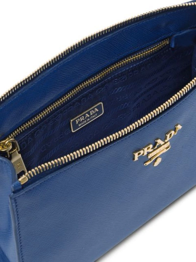 Shop Prada Logo Plaque Clutch In Blue