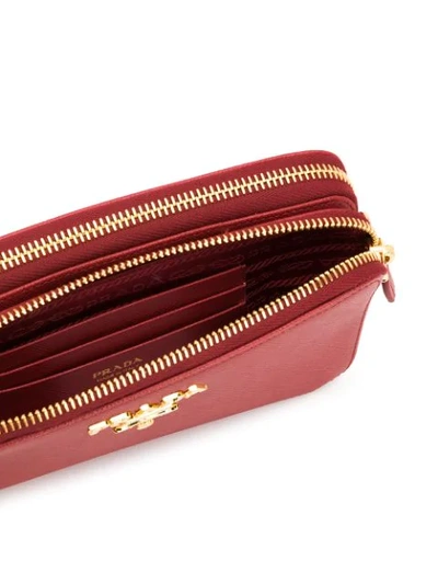 Shop Prada Saffiano Mini Crossbody Bag - Red