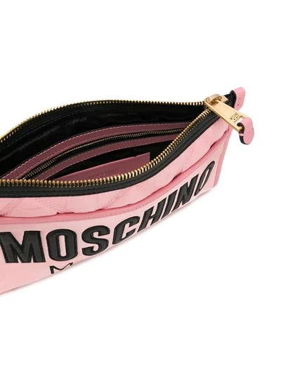 Shop Moschino Quilted Logo Clutch In Pink