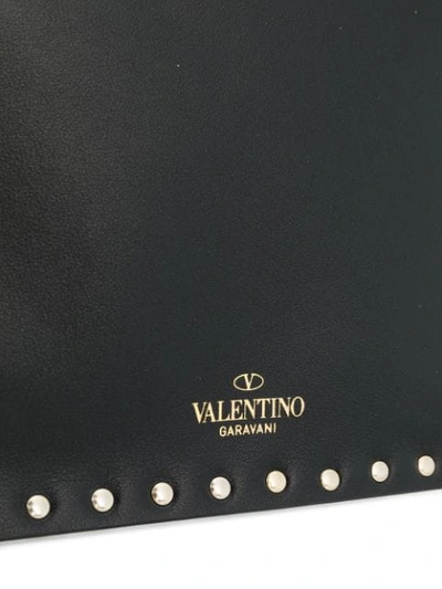 Shop Valentino Garavani Rockstud Clutch In 0no - Black