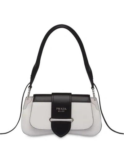 Shop Prada Buckled Sidonie Shoulder Bag In F0964 White/black