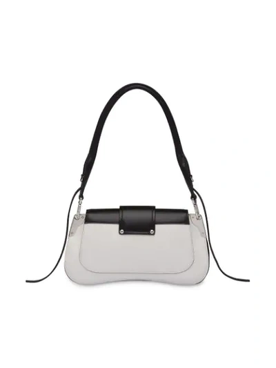 Shop Prada Buckled Sidonie Shoulder Bag In F0964 White/black