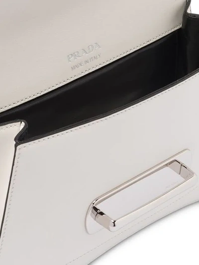 Shop Prada Buckled Sidonie Shoulder Bag In F0964 White/black