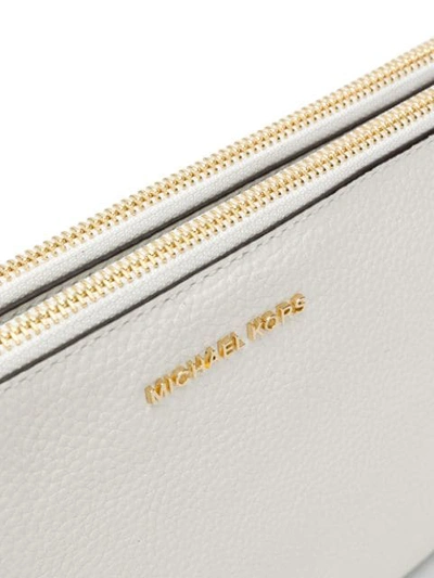 Shop Michael Michael Kors Zipped Clutch Bag In White