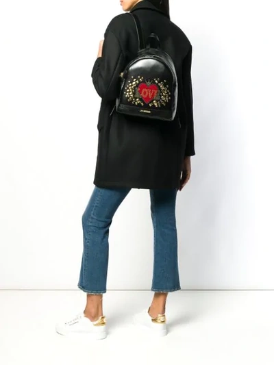 Shop Love Moschino Love Embellished Heart Backpack In Black