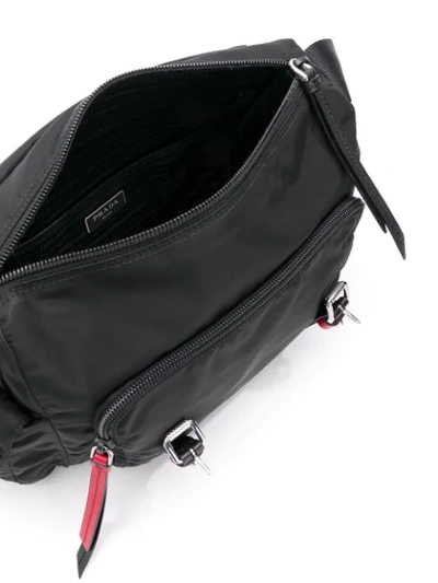 Shop Prada Studded Strap Crossbody Bag In Black