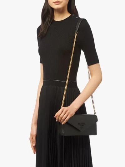 Shop Prada Monochrome Saffiano Clutch Bag In Black