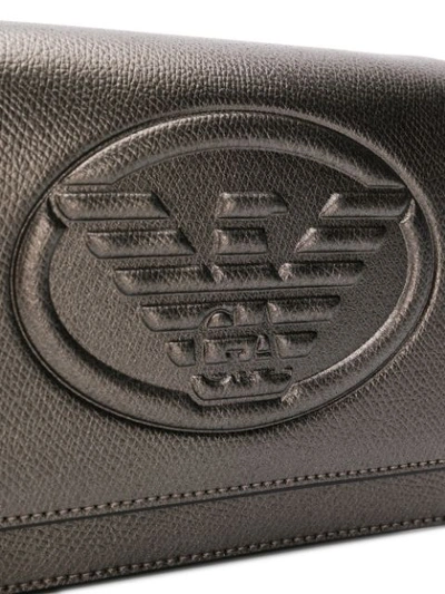 Shop Emporio Armani Embossed Logo Cross-body Bag - Metallic