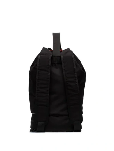 Shop Ganni Triple-strap Drawstring Backpack In Black