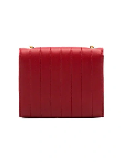Shop Saint Laurent Red Vicky Quilted Leather Clutch Bag