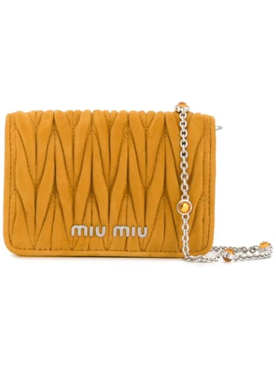 Shop Miu Miu Micro Matelassé Crossbody Bag In Yellow