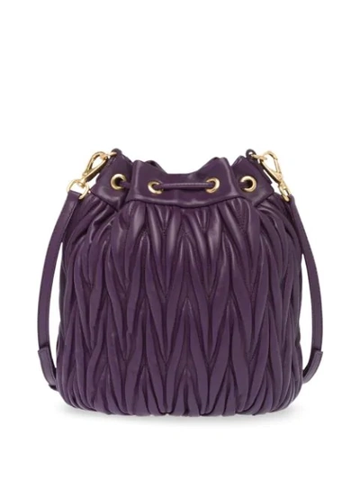 Shop Miu Miu Matelassé Drawstring Bucket Bag In Purple