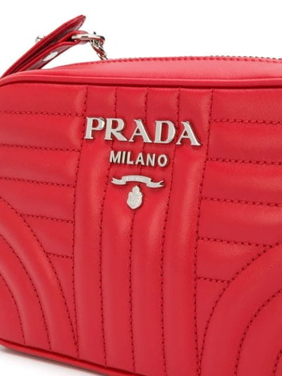 Shop Prada Bevelled Leather Cross-body Bag In Red