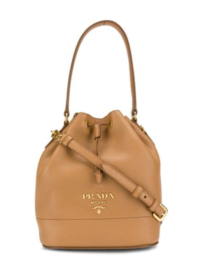 Shop Prada Logo Plaque Bucket Bag - Brown