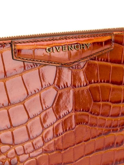 Shop Givenchy Logo Clutch Bag In Brown