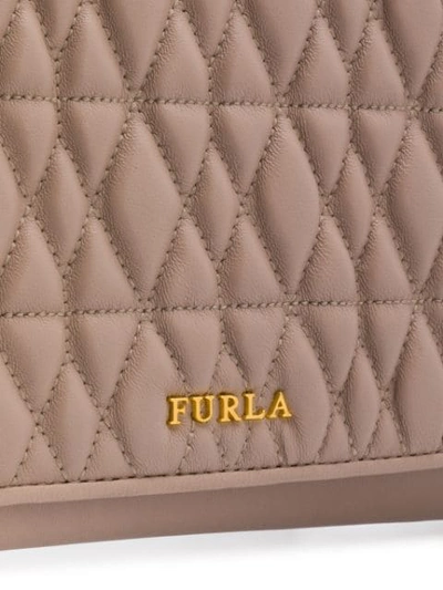 Shop Furla Quilted Logo Clutch In Neutrals
