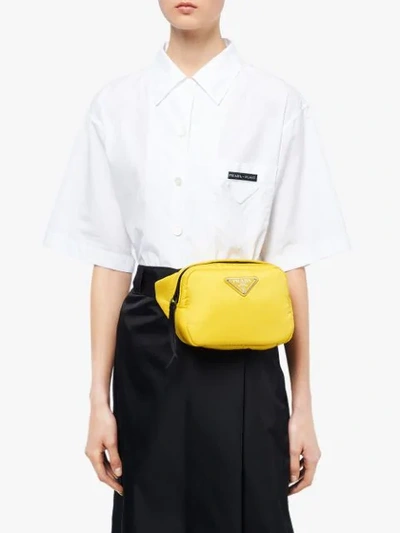 Shop Prada Padded Belt Bag In Yellow