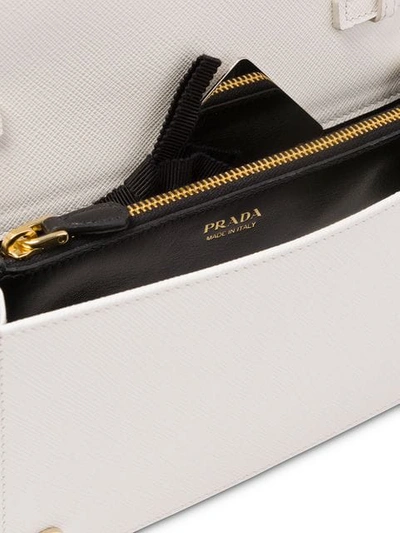 Shop Prada Schultertasche Aus Saffiano-leder In White