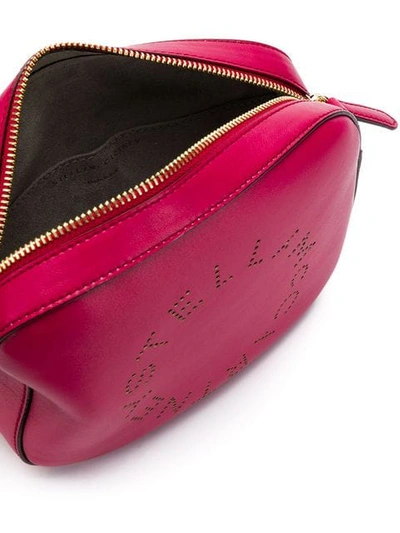 Shop Stella Mccartney Perforated Logo Crossbody Bag - Pink