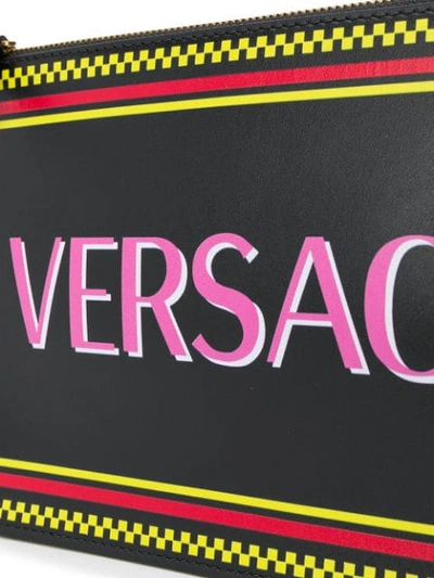 Shop Versace Logo Print Clutch Bag In Black