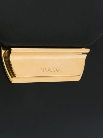 Shop Prada Logo Plaque Top Handle Bag In Black