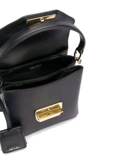 Shop Prada Logo Plaque Top Handle Bag In Black